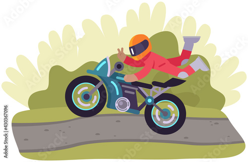 Young man in helmet riding motorcycle on background of nature landscape. Hipster motorcyclist driving motorcycle on road and doing stunts. Guy is engaged in extreme sports. Riding bike in park