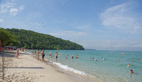  Sai Kaew Beach Sattahip- Military Beach.People sunbathe and swim.The man with the child goes to swim