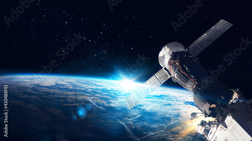 Space station on orbit of the Earth planet and universe background. Elements of this image furnished by NASA