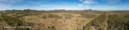 Aerial panoramic view of the Bruce Highway at Kunwarara in Queensland Australia; the view encompasses the Lake Learmouth State Forest.