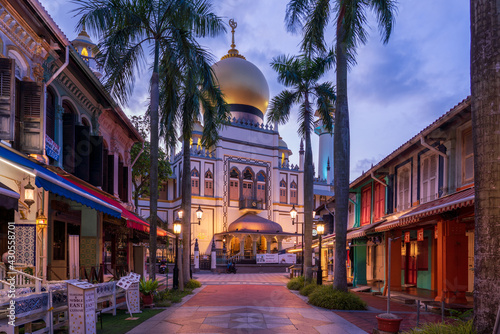 Illuminated Arab street and Masjid Sultan Mosque with no people during city lock down at Kampong Glam, Singapore.