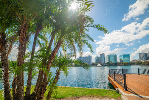 Sun shining over beautiful Lake Eola park in Orlando