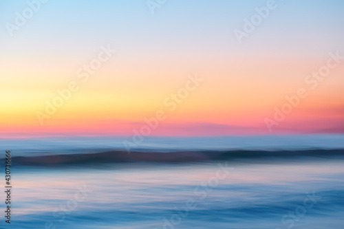 Copy space of soft sand sea and blur tropical beach with sunset sky and cloud abstract background.