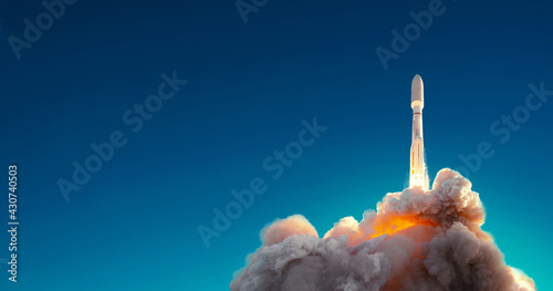 Rocket successfully launched into space against blue sky. Spaceship lift off