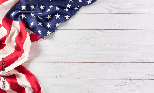 Happy memorial day concept made from vintage american flag on white wooden background.