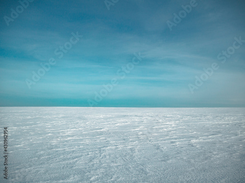 almost clear and blue sky, almost flat and clean snow