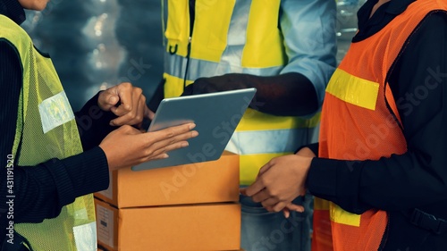 Warehouse worker working together in the storehouse . Logistics , supply chain and warehouse business concept .