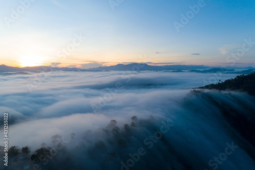 Amazing Landscape light nature scenery view, Beautiful light sunrise or sunset over Tropical sea and foggy mist on mountains peak in thailand Aerial view Drone camera shot High angle view