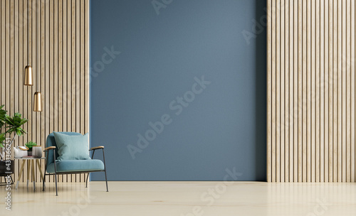 Stylish Modern wooden living room has an armchair on empty dark blue wall background.