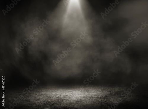 Empty space studio dark room of concrete floor grunge texture background with spot lighting and fog in black background.