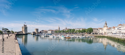 Panorama of the old harbor of La Rochelle, the French city and seaport on a sunny day. beautiful blue sky.