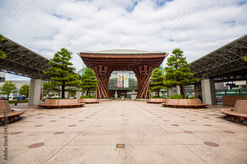 Tsuzumi Gate at Kanazawa Train Station. Shinkansen wide open empty platform forecourt entrance. Wooden structure Japanese design. Background. Japan.