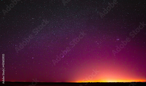 Night Sky Glowing Stars Background Backdrop. Colorful Sky Gradient. Sunset, Sunrise Lights And Colourful Night Starry Sky In Yellow Pink Magenta Orange Purple Colors. Dark Ground. Copy Space