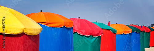 Beach umbrellas, Deauville, Normandy, France. Colorful web banner.