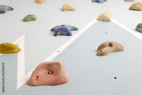 Home climbing wall in blue color with a pattern in the form of mountains with snow-capped peaks for home sports