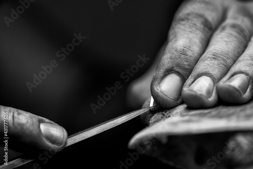 Goldsmith's hands at work, handmade jewelery
