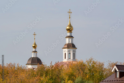 View of Ascension Church (Voznesenskaya church, 1724) above autumn foliage on sunny day. Vladimir, Russia.