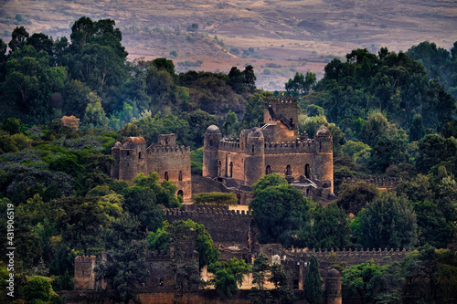 Aerial view at Fasilides castle in Gondar in Ethiopia. Green trees with old building in Africa landscape. Ethiopia, Gondër Royal Enclosure (Fasil Ghebbi), UNESCO WoWorld Heritage List. Traveling.