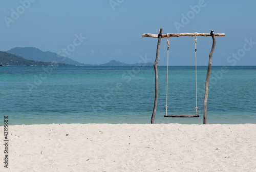 The wooden swing on the beach.