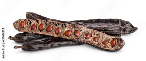 Ripe carob pods and bean isolated on white background with clipping path and full depth of field