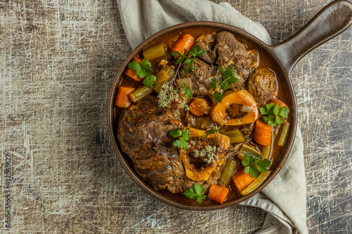 Osso buco traditional italian meat dish served in pan