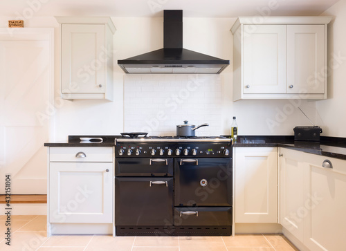 Modern modular kitchen interior, range cooker and chimney hood