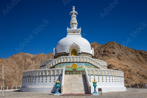 White buddhist stupa or pagoda in tibetan monastery near village Leh in ladakh, noth India