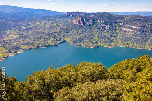 Aerial view of a part of the Sau reservoir, with the Munts cliffs in the background. Tavertet. Collsacabra, Osona, Catalonia, Spain