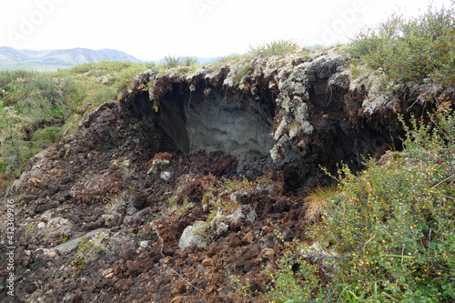 Arctic permafrost thawing in Alaska and Canada, global warming climate change concept, collapse of soil mud and create thermokarst lake