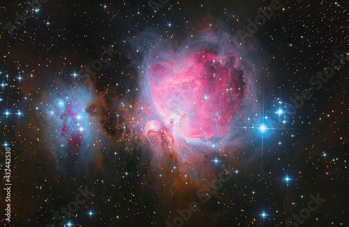 Orion Nebula in the constellation Orion with colorful stars and vibrant colors in space seen through a telescope. M42