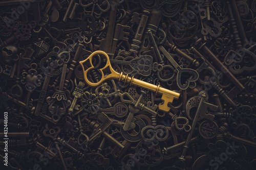 Unique gold key on pile of vintage skeleton keys. Concept for individual or uniqueness, unlocking potential, or stand out from the crowd.