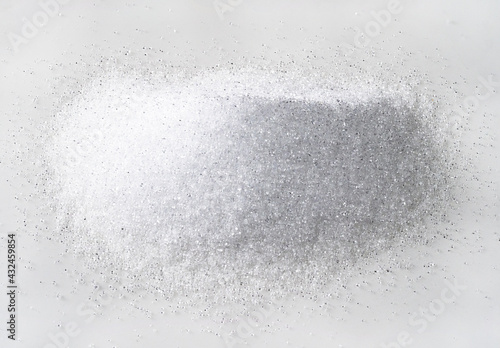 handful of crystalline erythritol on white plate