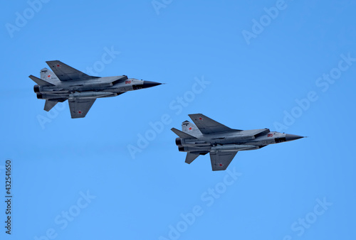 MOSCOW, RUSSIA - MAY 7, 2021: Avia parade in Moscow. group jet fighter aircraft Mikoyan MiG-31 in the sky on parade of Victory in World War II in Moscow, Russia