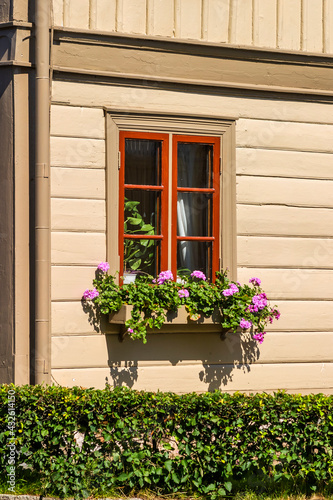 Flower box by a beautiful wooden house