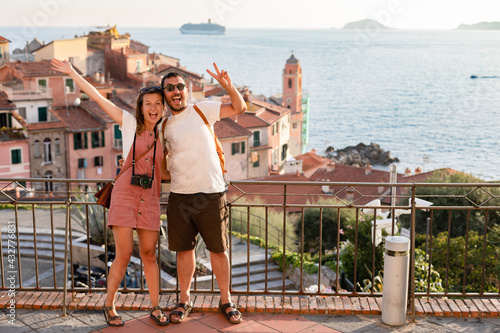 happy tourist couple in love take selfie in Tellaro village, Lerici. Holidays in Liguria region, Italia 