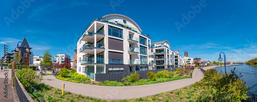 Panoramic view over modern houses at Elbe river in early Spring in Magdeburg, Germany, at blue sky and sunny day