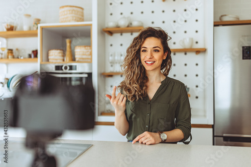 Social media influencer creating content at home.