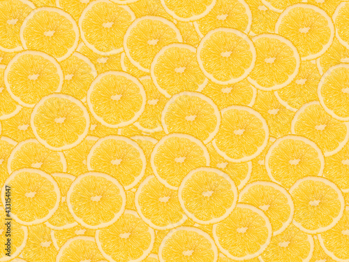 Seamless pattern with lemon slices. Top view, food concept, fruit background.
