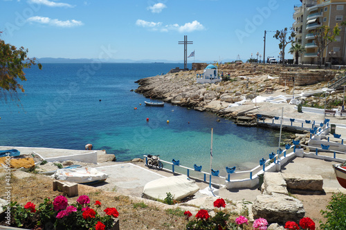 Small cosy bay of Afrodite and chapel of Saint Nicholas in Piraiki area of Piraeus as seen at spring with beauitiful flowers, Attica, Greece