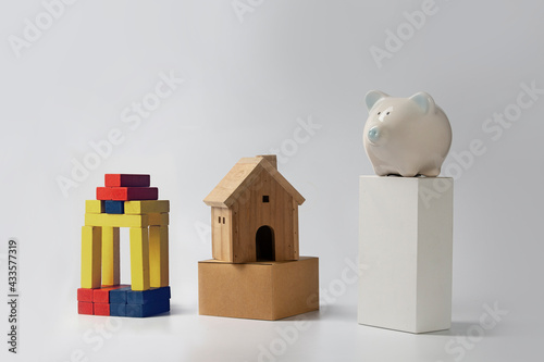Pig piggy bank with wooden blocks arranged in a bar graph concept savings commensurate with the investment