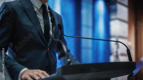 Close up of a Organization Representative Speaking at Press Conference in Government Building. Press Officer Delivering a Speech at Summit. Minister Speaking at Congress Hearing.