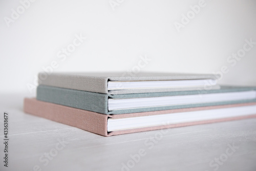 Pile of books with color linen cover on the table