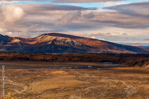 dramatic landscape of mountain peaks and mountain ranges inside Denali National Park during autumn season.