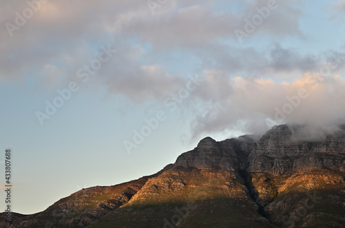 The sun setting over Botmaskop, part of Stellenbosch Mountain in the Western Cape