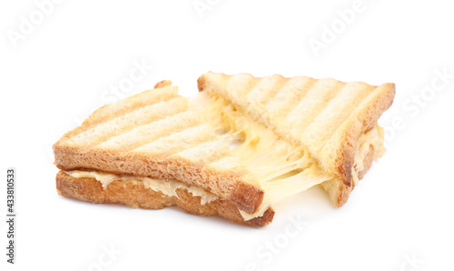 Fresh tasty cheese sandwich cut in half on white background