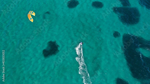 Aerial drone photo of kite surfer practise in tropical exotic island bay with emerald crystal clear sea