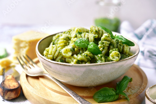 Fusilli pasta with pesto sauce - traditional dish of italian cuisine.