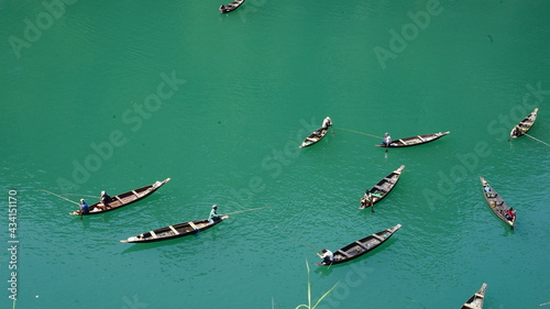 People fishing in Dawki River Meghalaya india . 