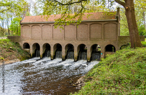 The old weir with the name "schuivenhuisje" built in 1887 on the Almelo-Nordhorn canal, province of Overijssel, the Netherlands