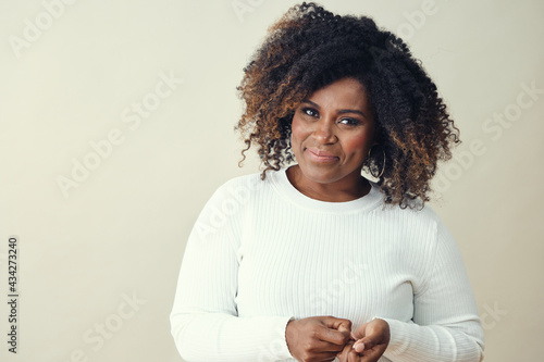 Smiling Woman in her 30's With Highlights Looking at camera